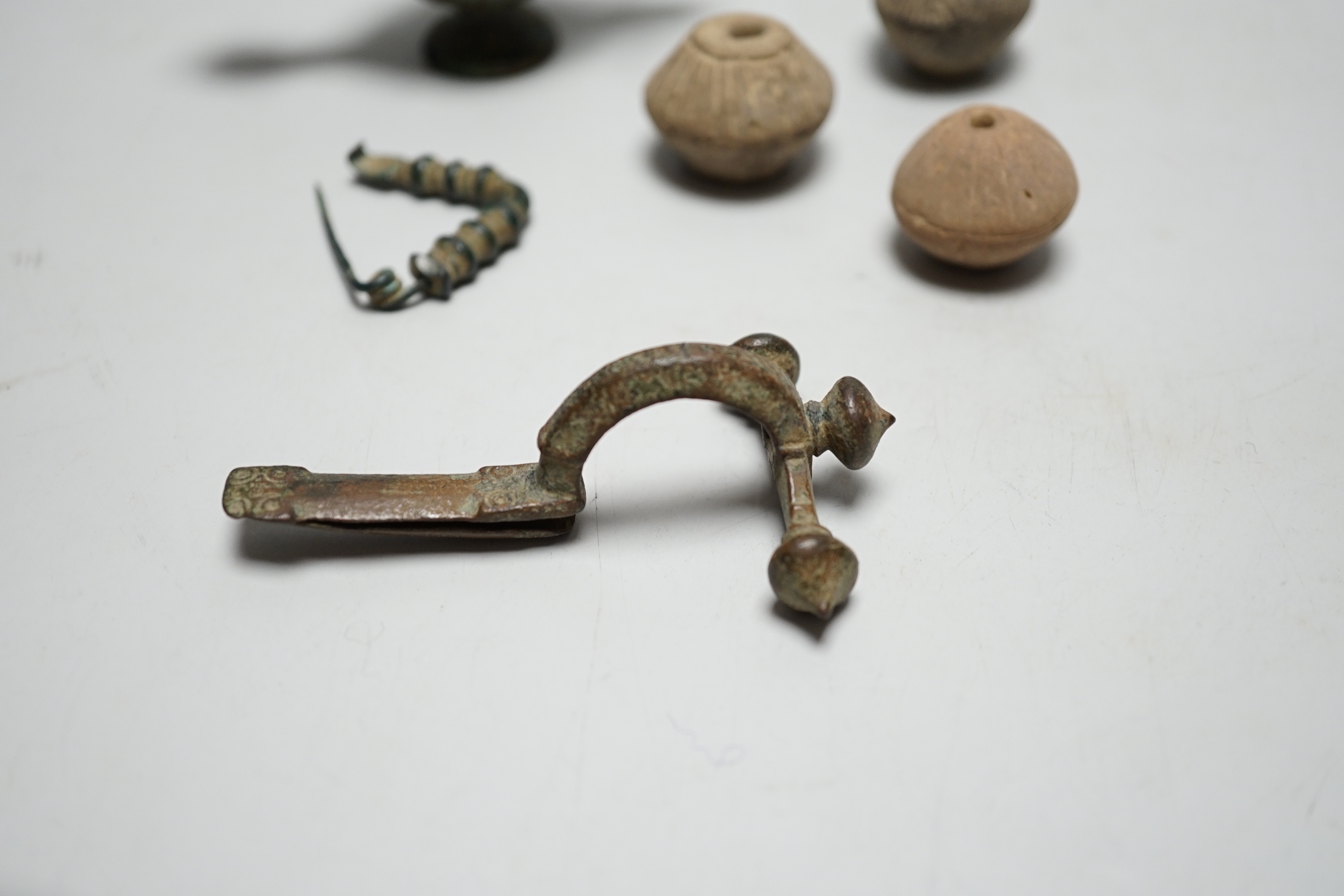 A collection of ancient bronze and terracotta items